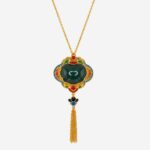 Verdant Majesty Cold Enamel Necklace with dark green center, multicolored floral frame, and golden tassel