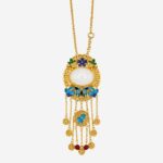 Azure Cloud Medallion Cold Enamel Necklace with oval white jade, blue cloud motifs, and seven golden tassels