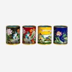 Four Fu Tong Cloisonné Enamel Art Cylinders featuring peony, landscape, and lotus motifs