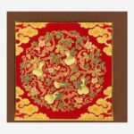 Close-up detail of Chinese silk brocade gourd and cloud pattern