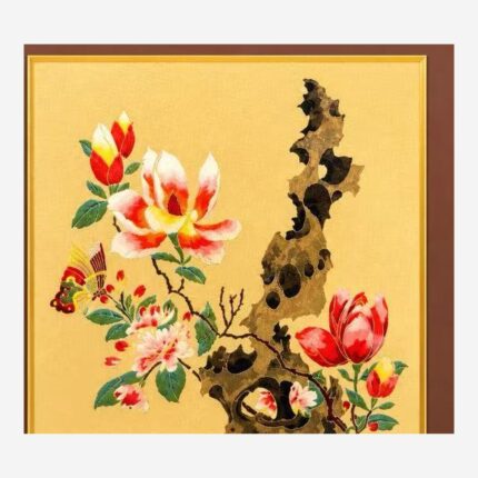 Close-up detail of Chinese silk brocade flower rock and moon artwork