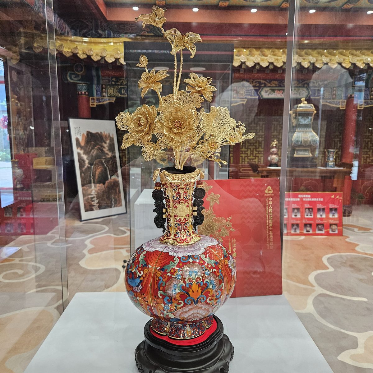 Cloisonne-style vase with gold lotus outlines and blue enamel color